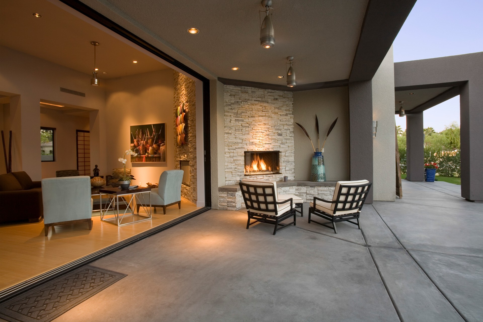 Chairs By Fireplace In Patio